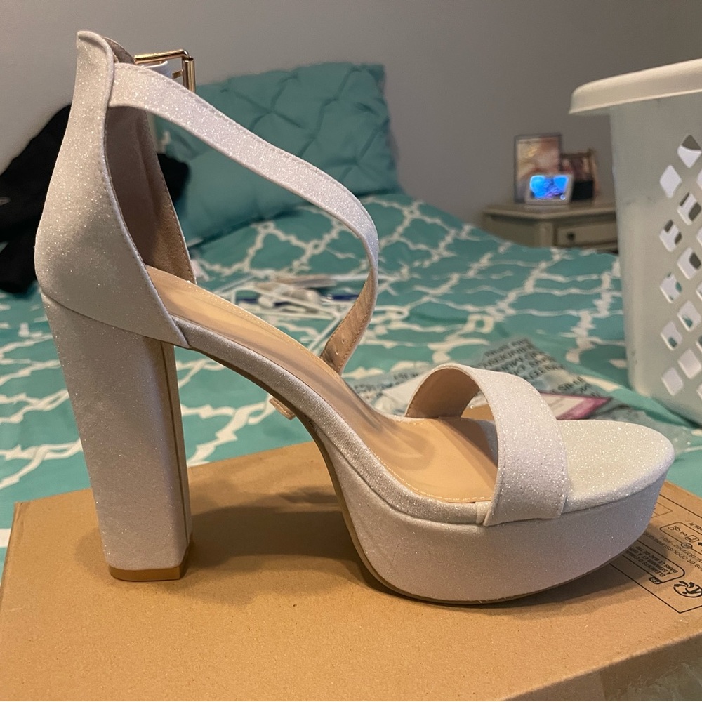Never worn women’s sparkly high heels.